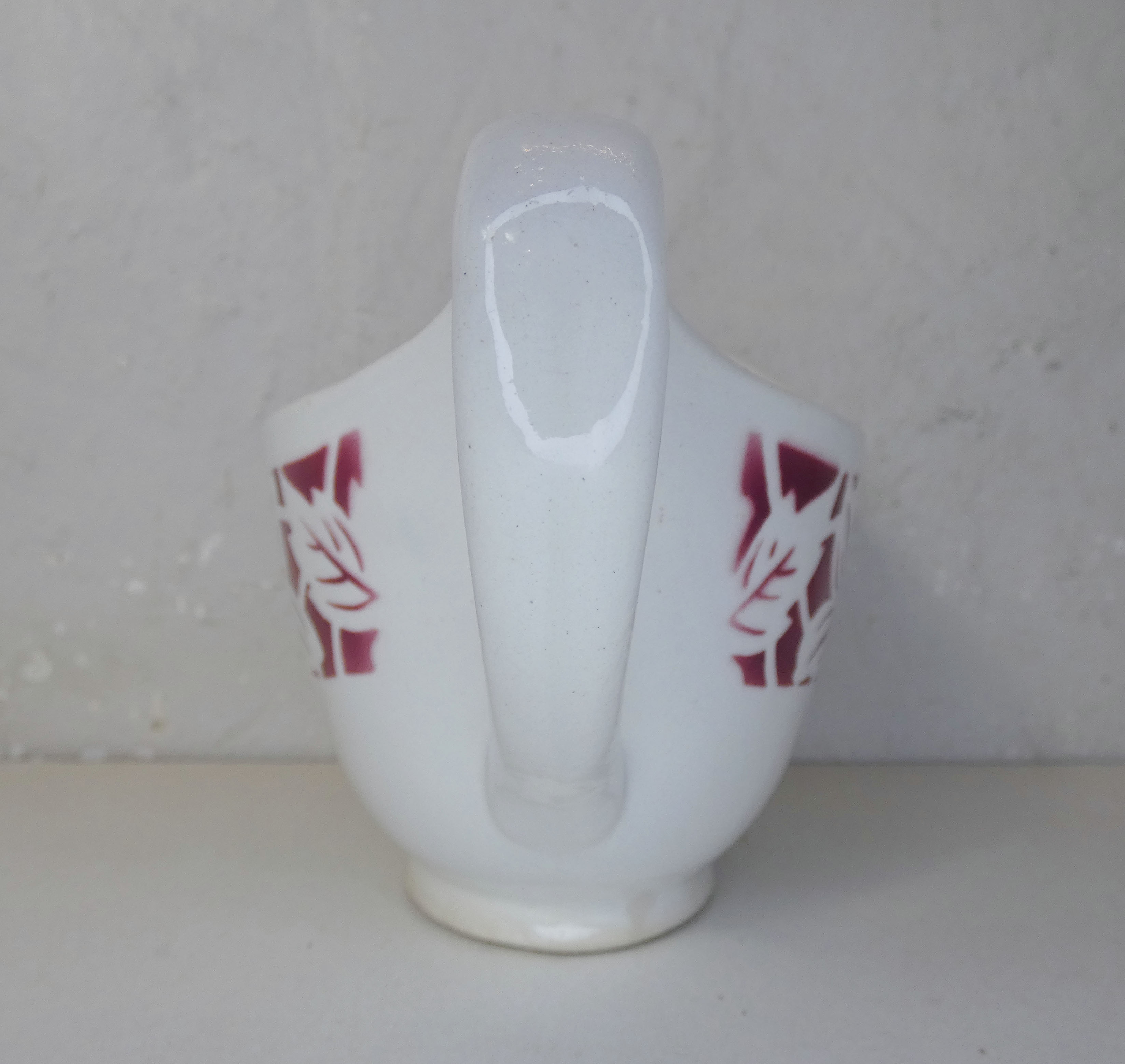 Old creamer milk pot in earthenware of Lunéville