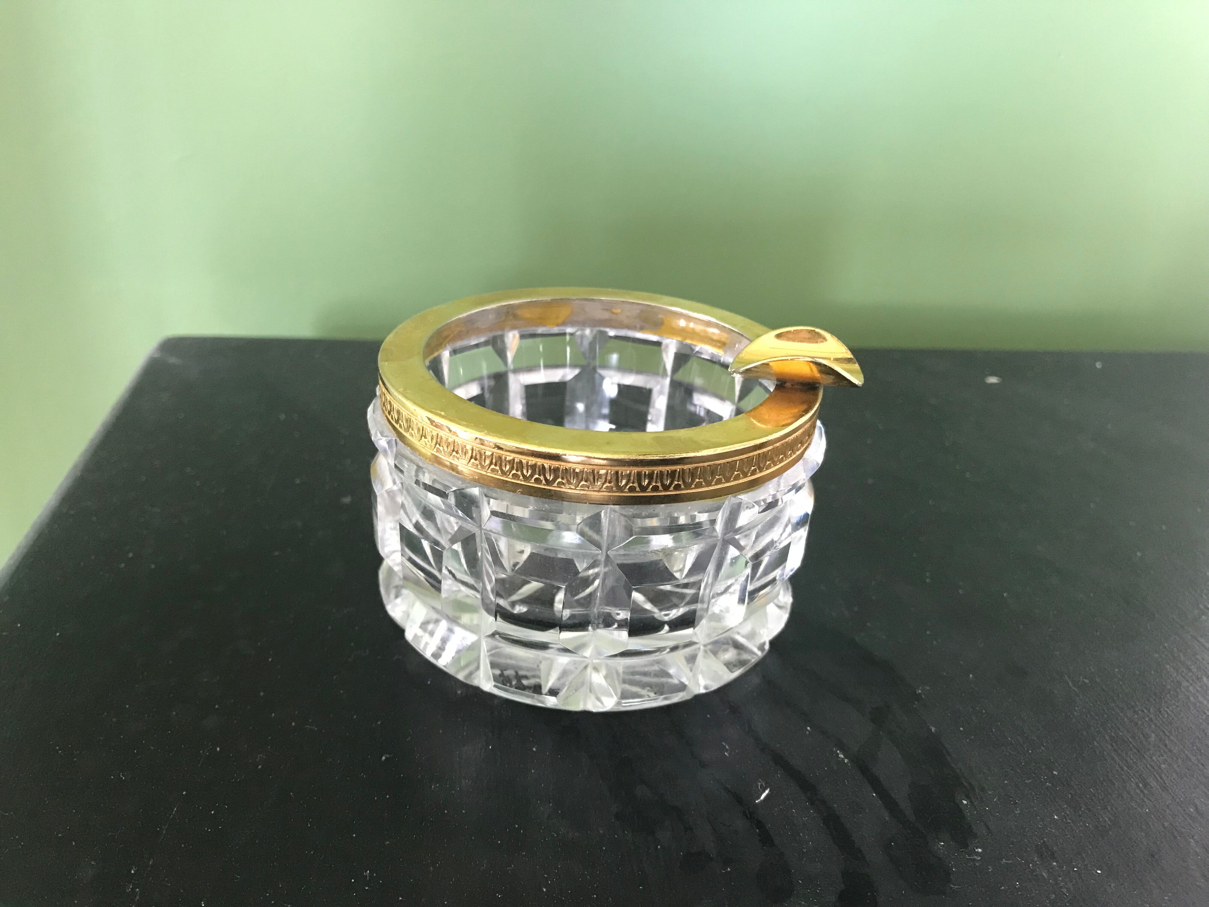 Glass ashtray and gold metal