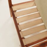 Vintage armchair in olive corduroy with a wooden frame.