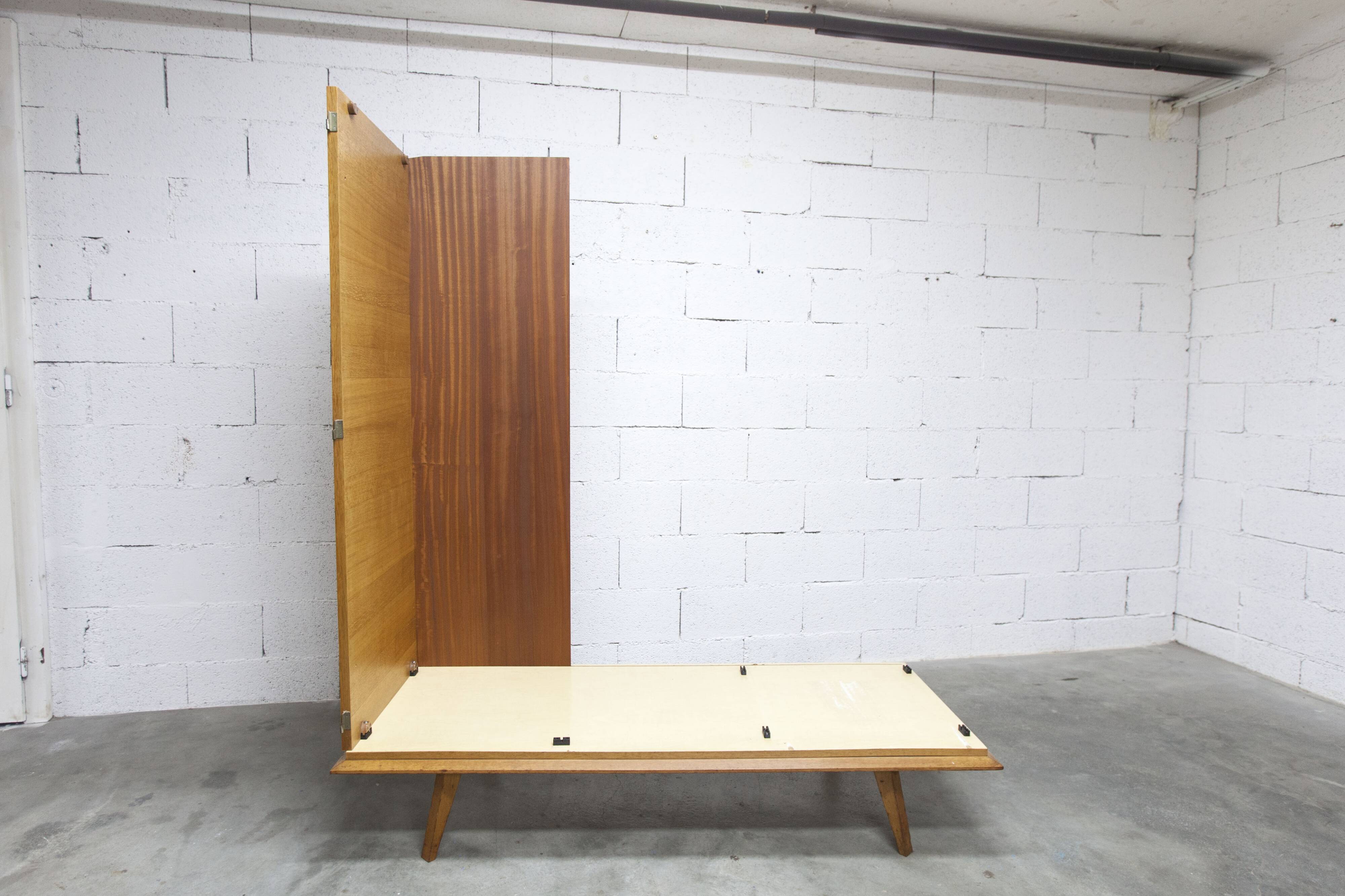 French wardrobe with tapered legs, 3 doors, 1 mirror (27*130), and 1 drawer.