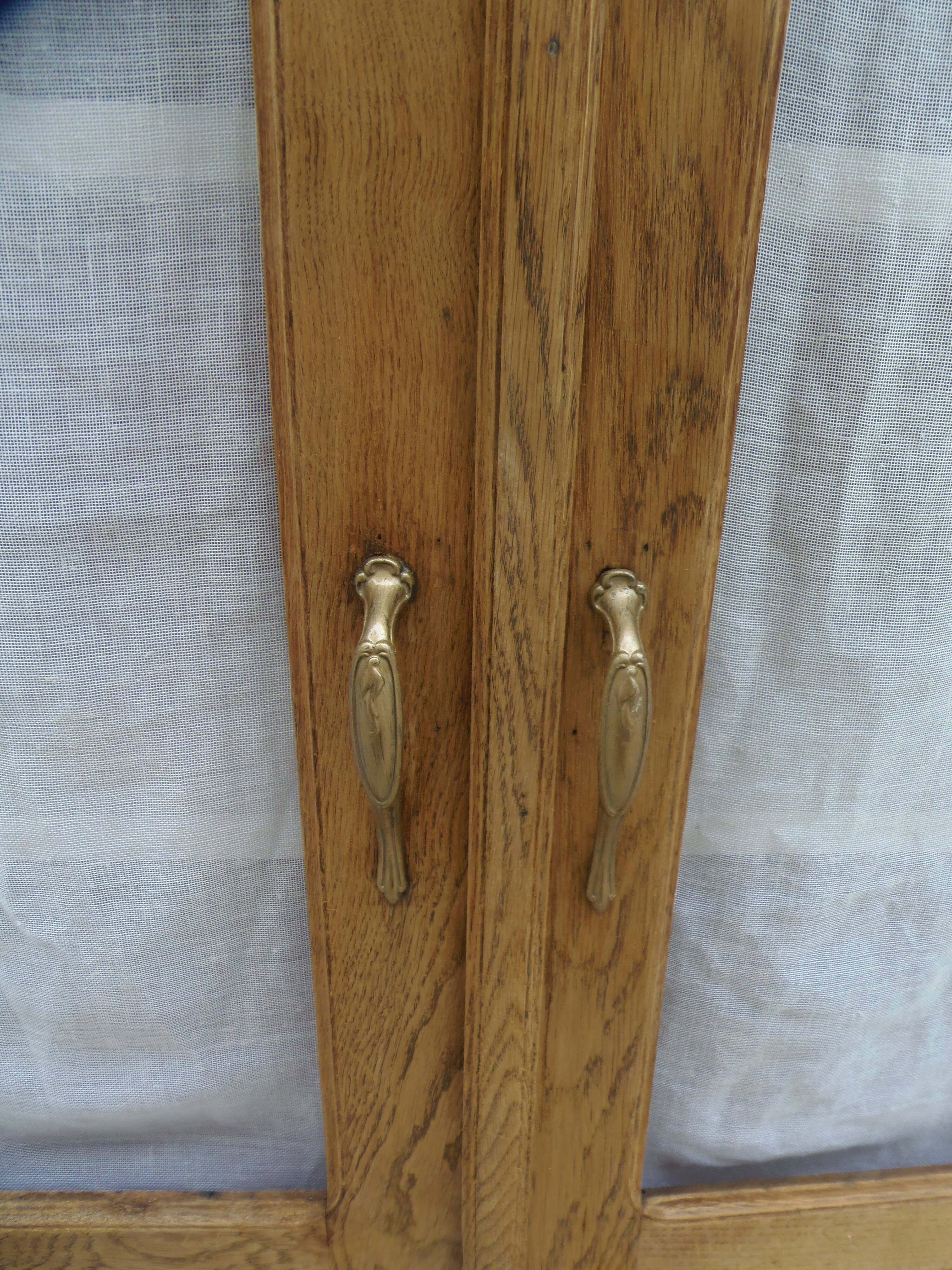 Antique wooden sideboard, fabric doors and pearl grey shelves.