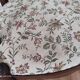 Pair of Provençal armchairs in brown wood and floral fabric.