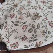 Pair of Provençal armchairs in brown wood and floral fabric.