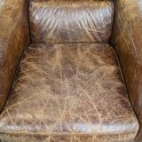 Grained cowhide armchair with a timeless design