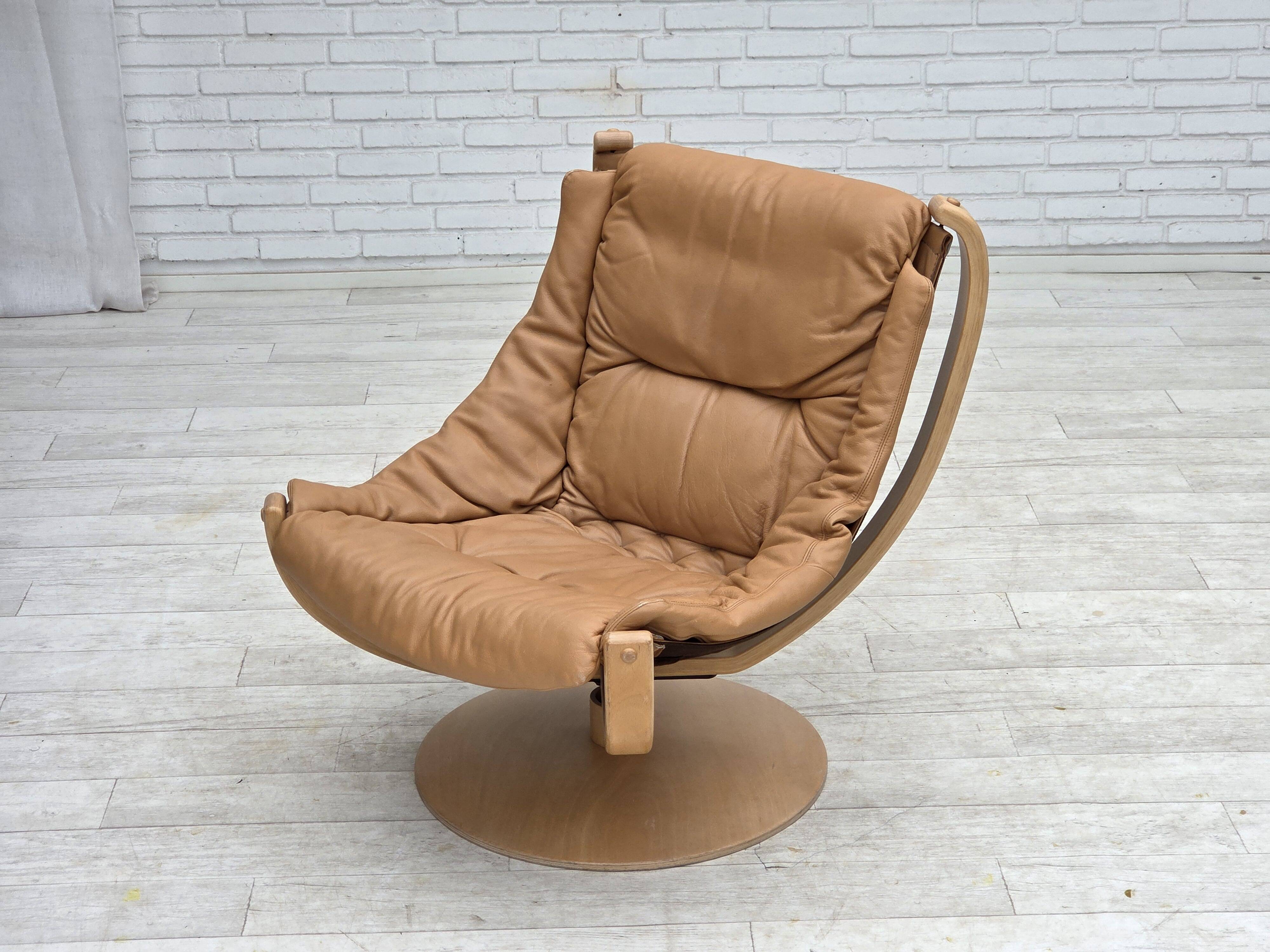 1980s, Scandinavian swivel armchair, furniture leather, bent wood.