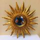 Sun mirror in carved gilded wood from the 1950s