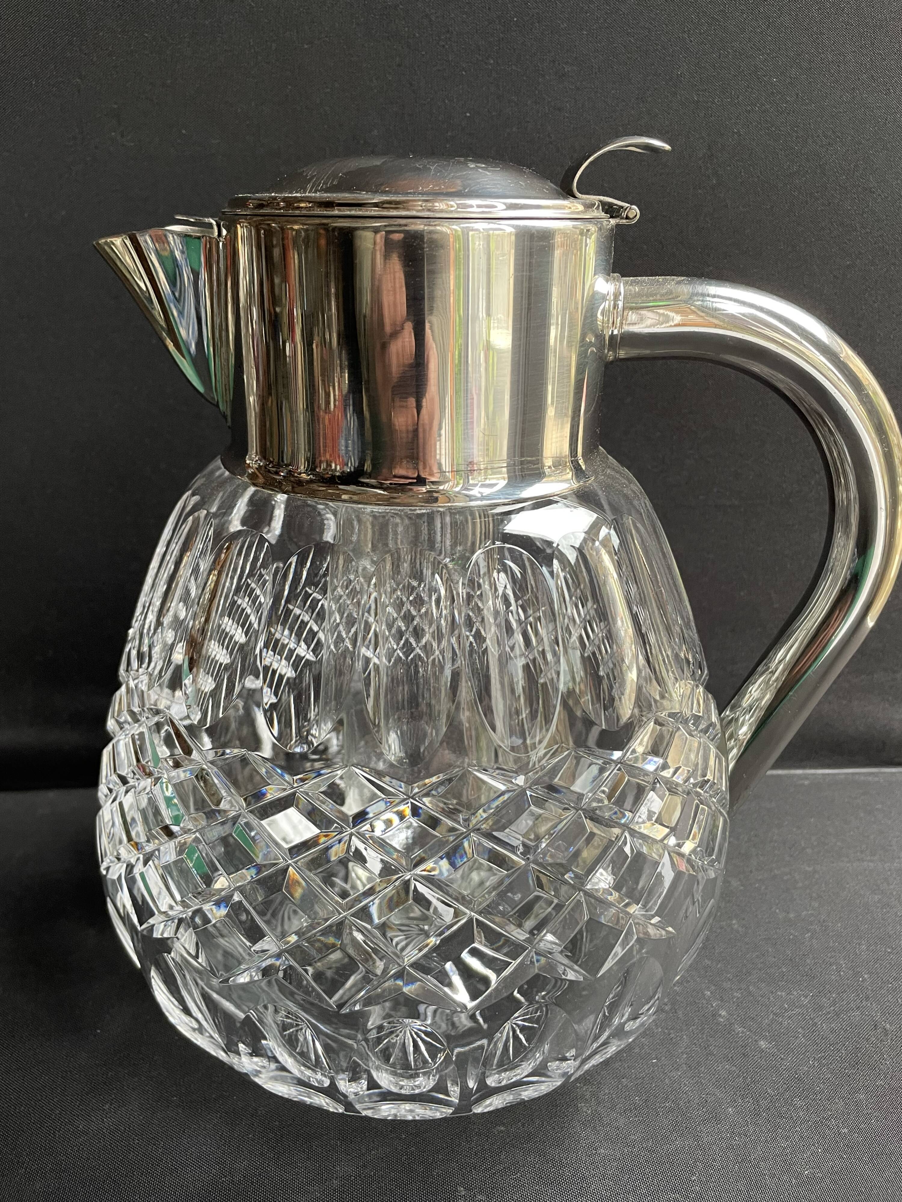 Important jug with ice reserve in cut crystal and silver-plated metal