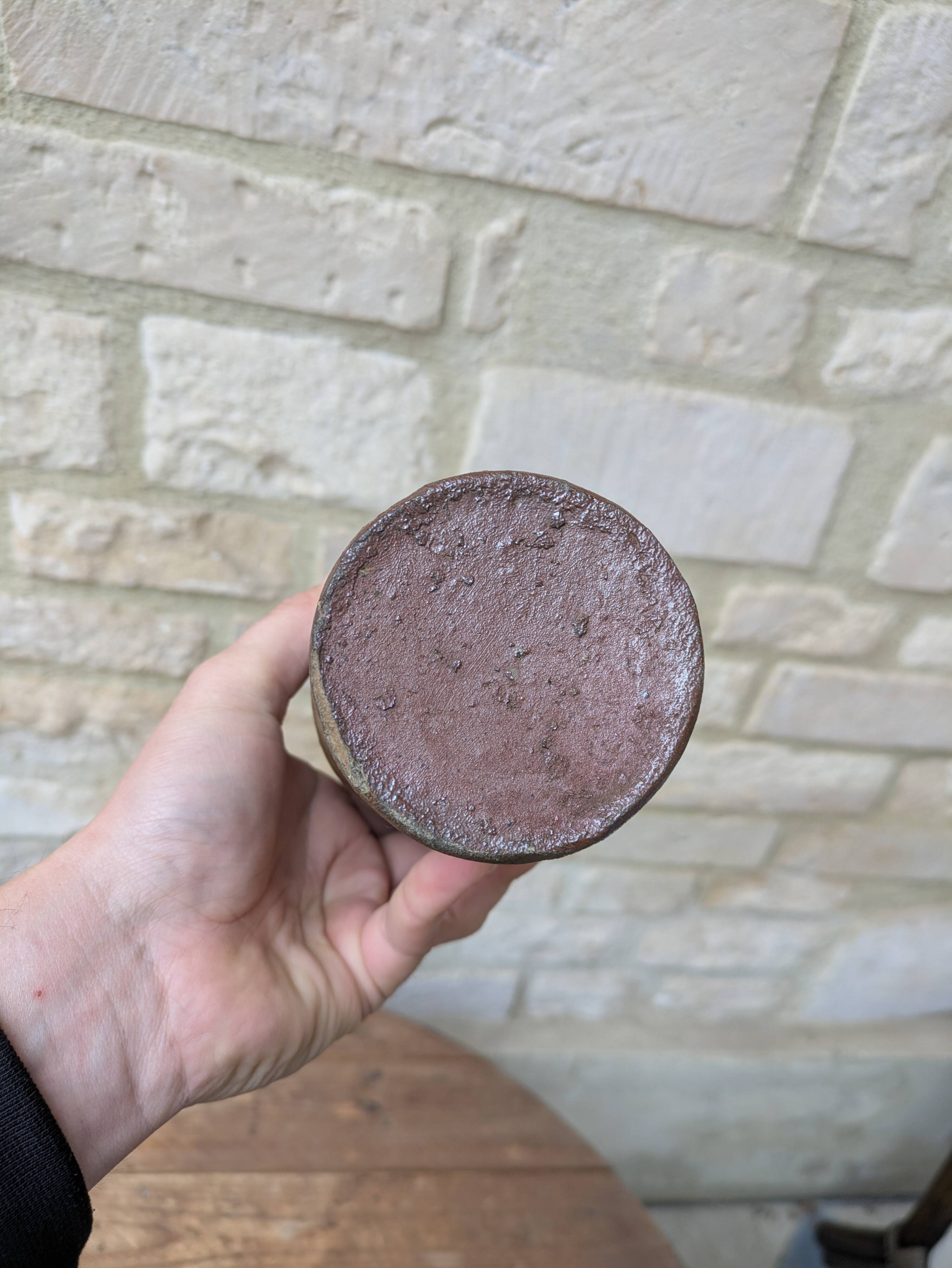 Old handmade terracotta bottle