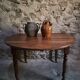 Antique drop-leaf dining table in walnut, France, circa 1900.