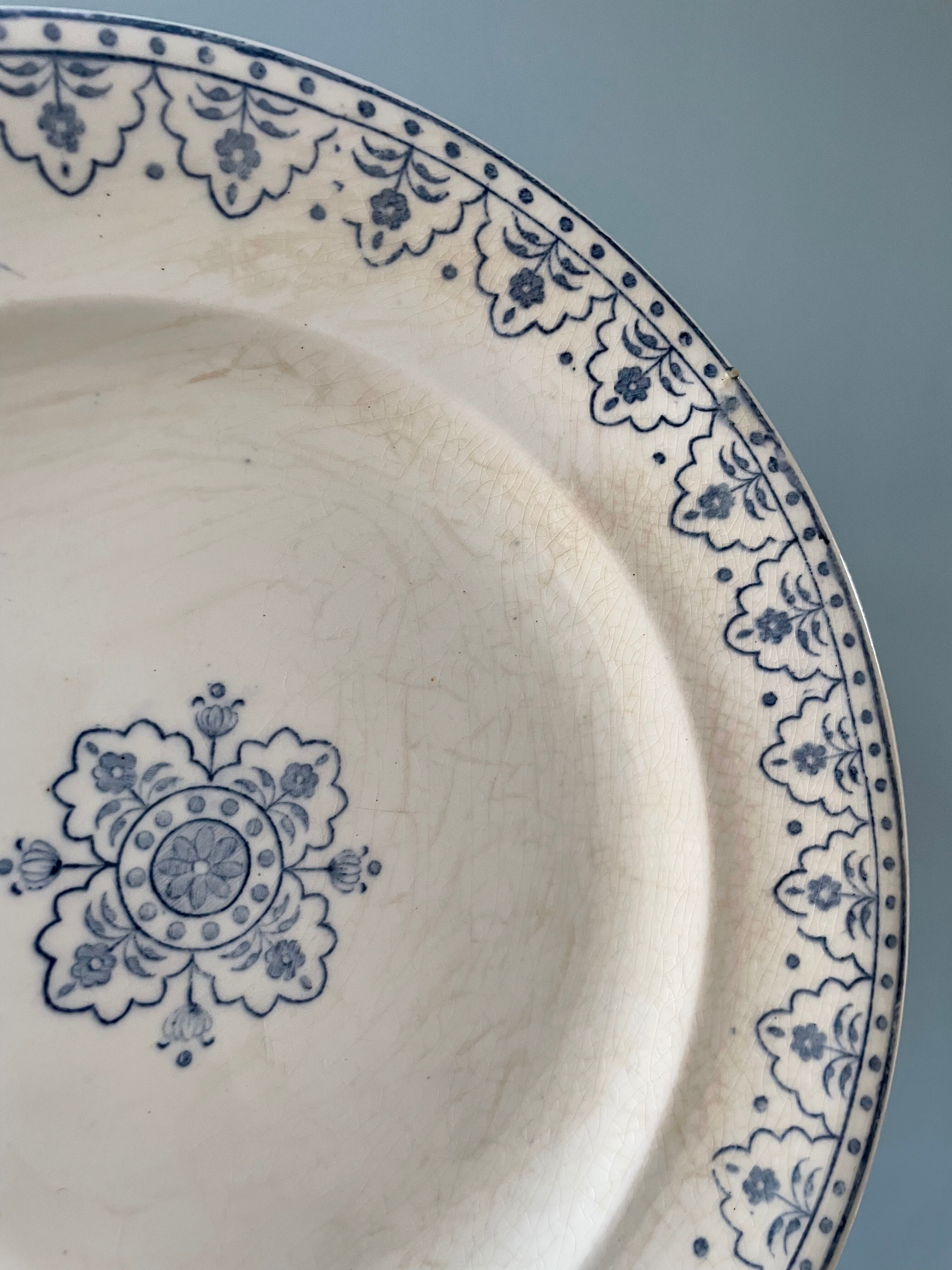 Series of 12 flat plates XIXth earthenware Terre de Fer Clairefontaine