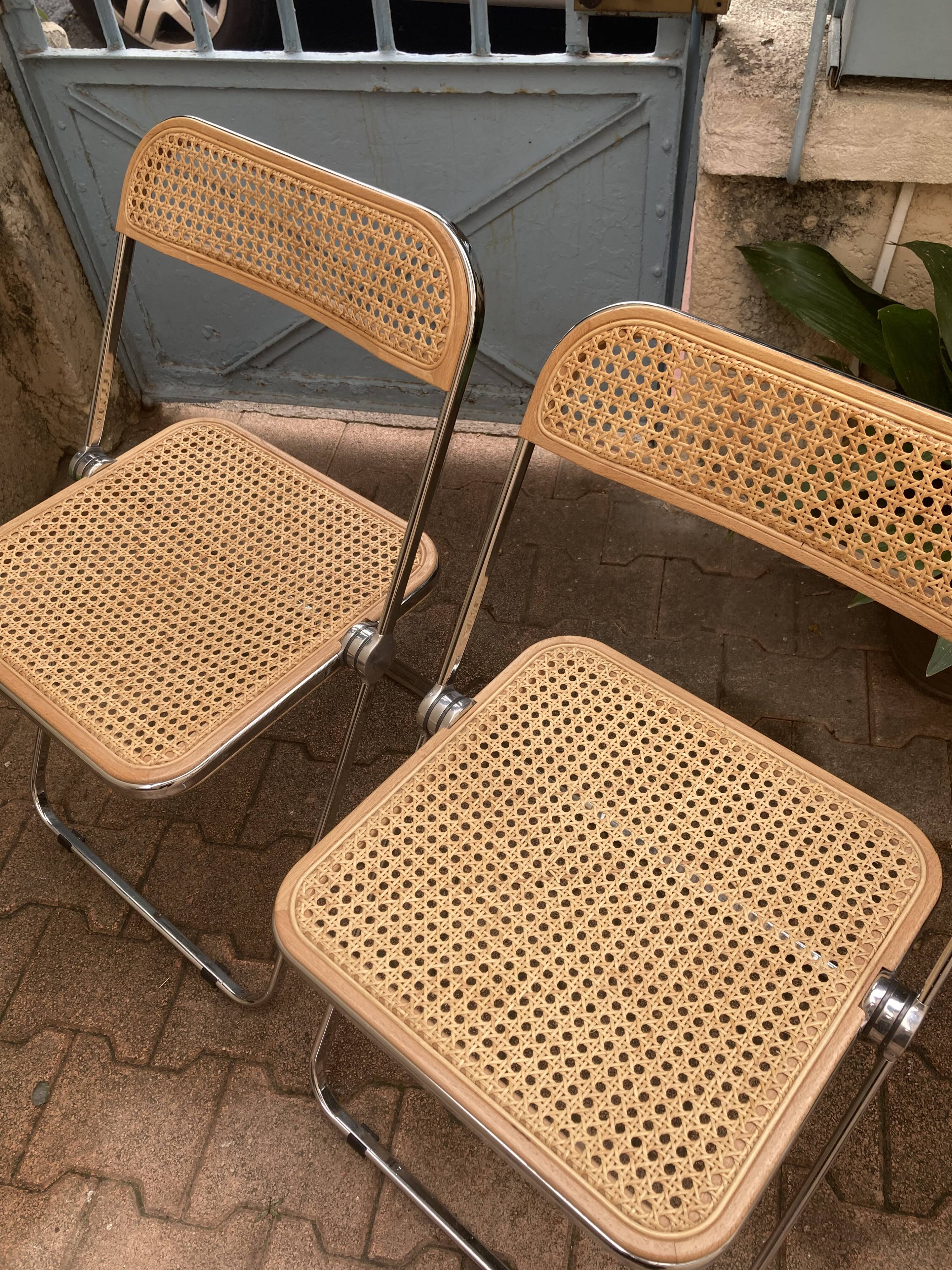 Plia chairs by Castelli in wood and cane.