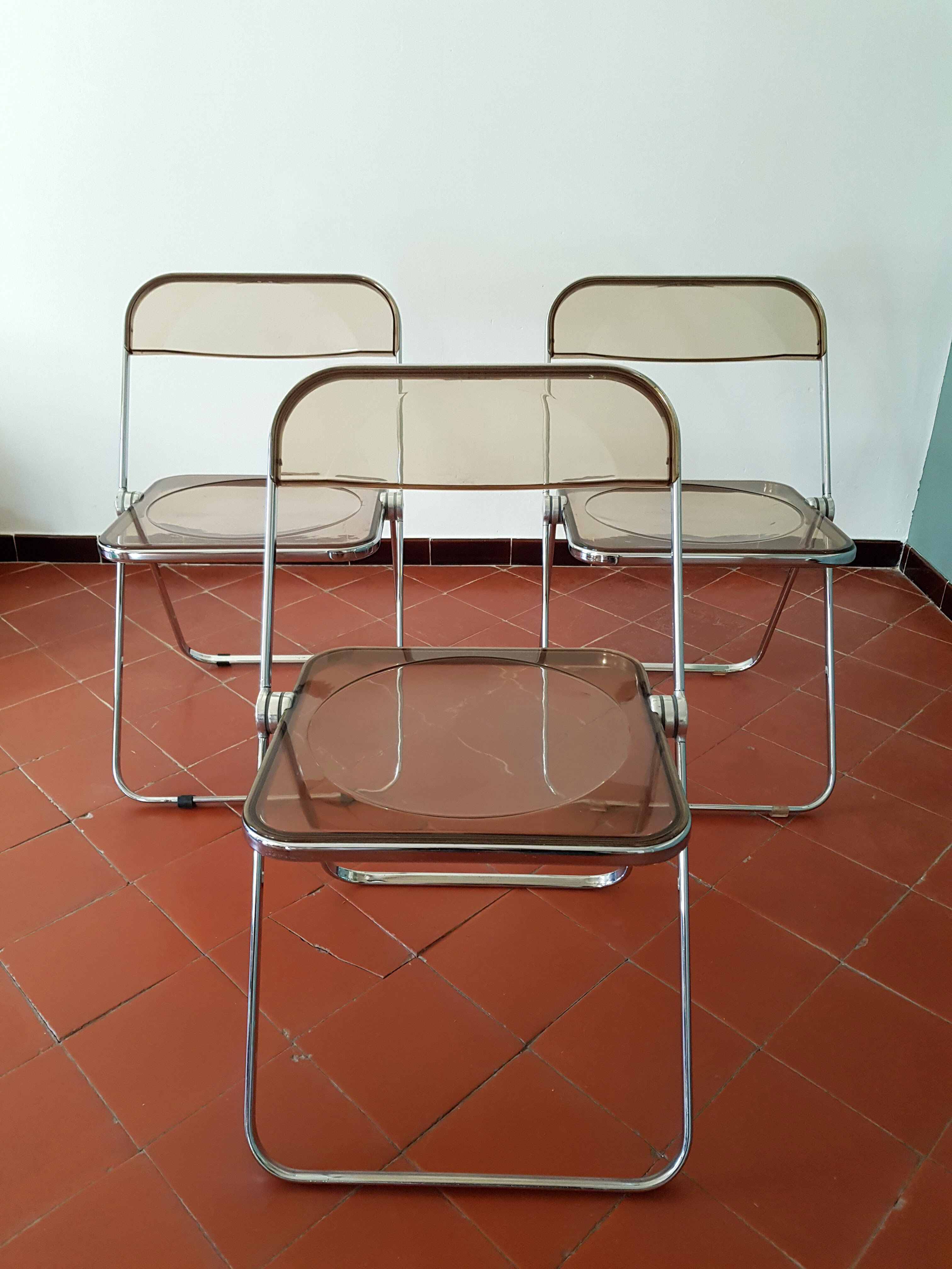 Trio of chairs folded Castelli design Giancarlo company