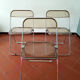Trio of chairs folded Castelli design Giancarlo company