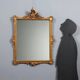 Antique Rococo-style mirror in carved gilded wood, 20th century.