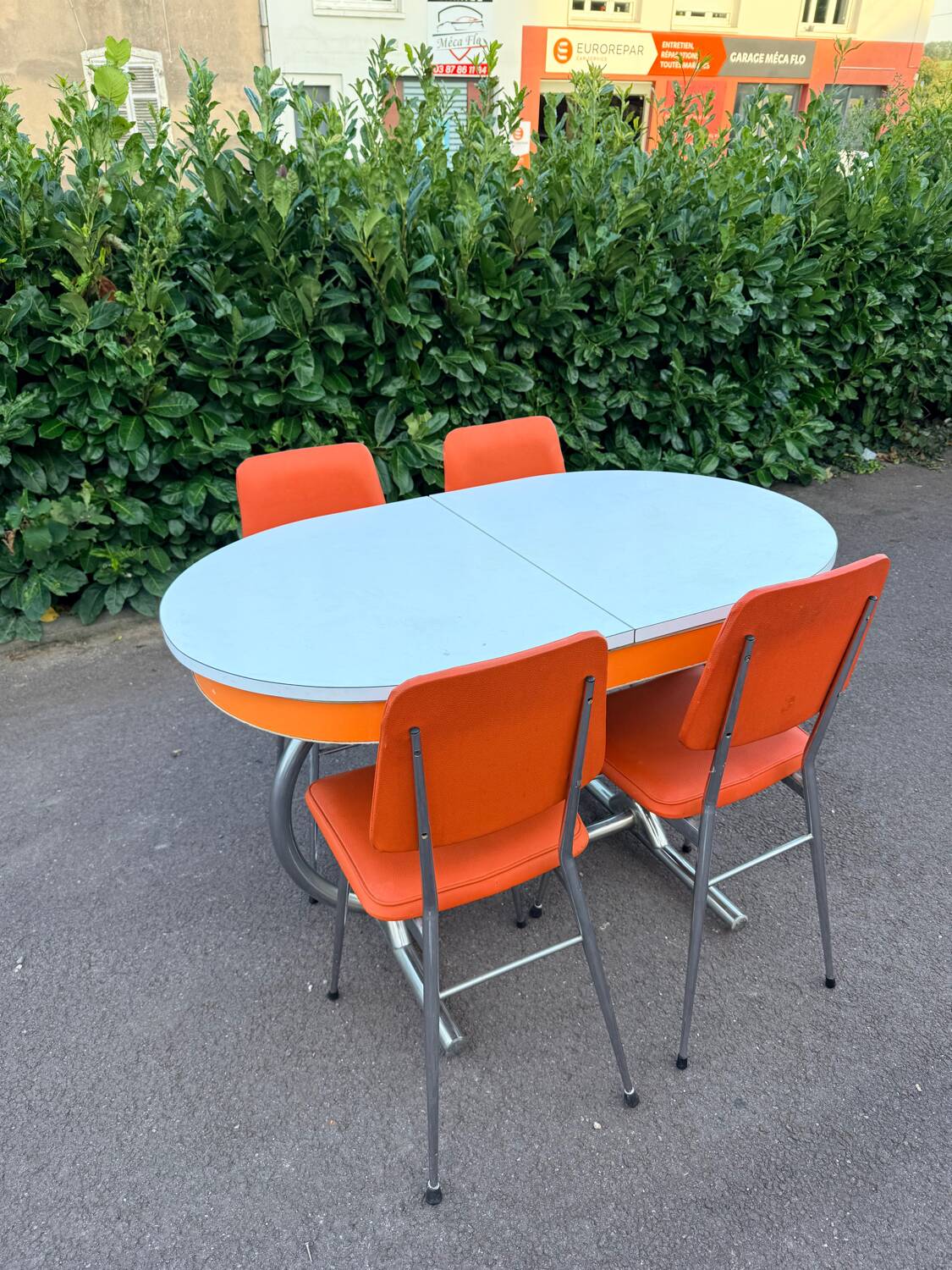 Formica leatherette chair with orange table, vintage 70s Space Age