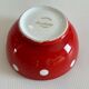 Red bowl with white polka dots signed Longchamp Porcelaine France