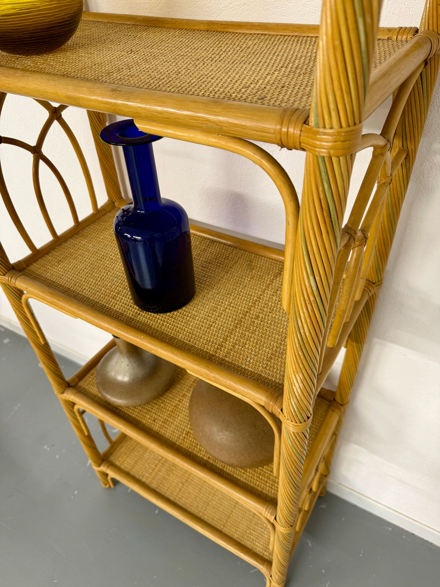 Large woven rattan bookshelf designed in the 1970s.