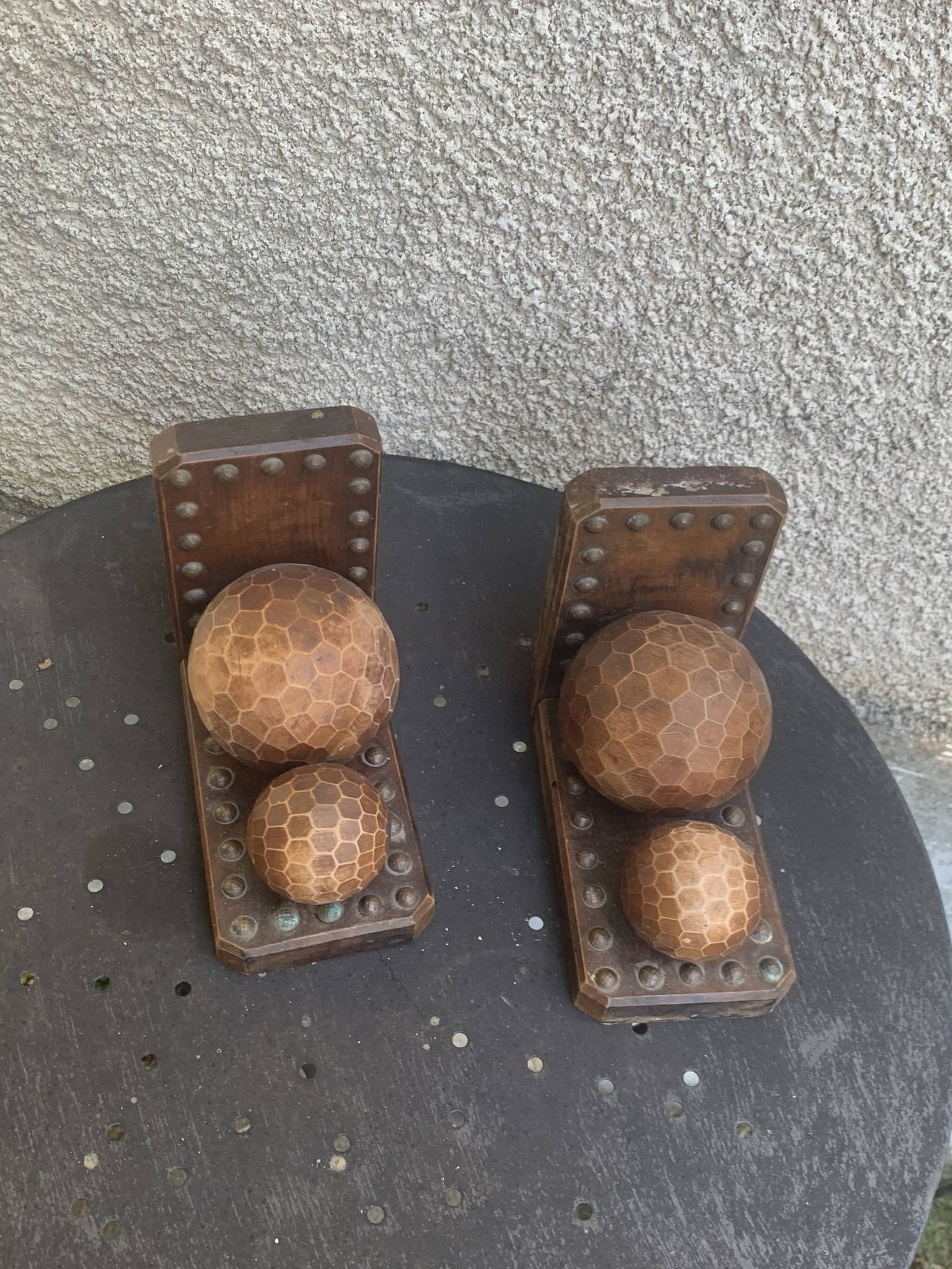 Pair of vintage carved wood and metal ball bookends