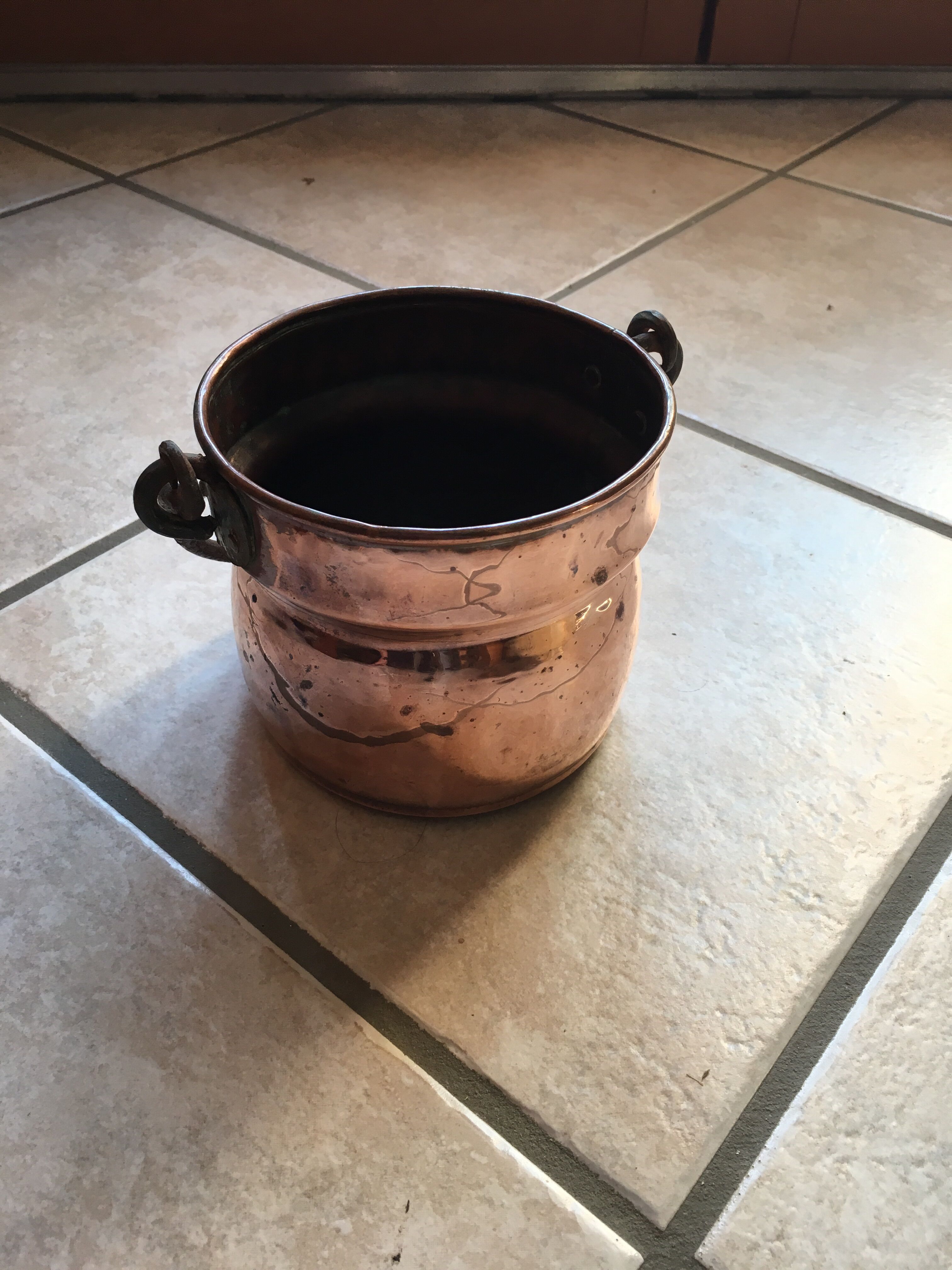 Old copper pot cover with cove