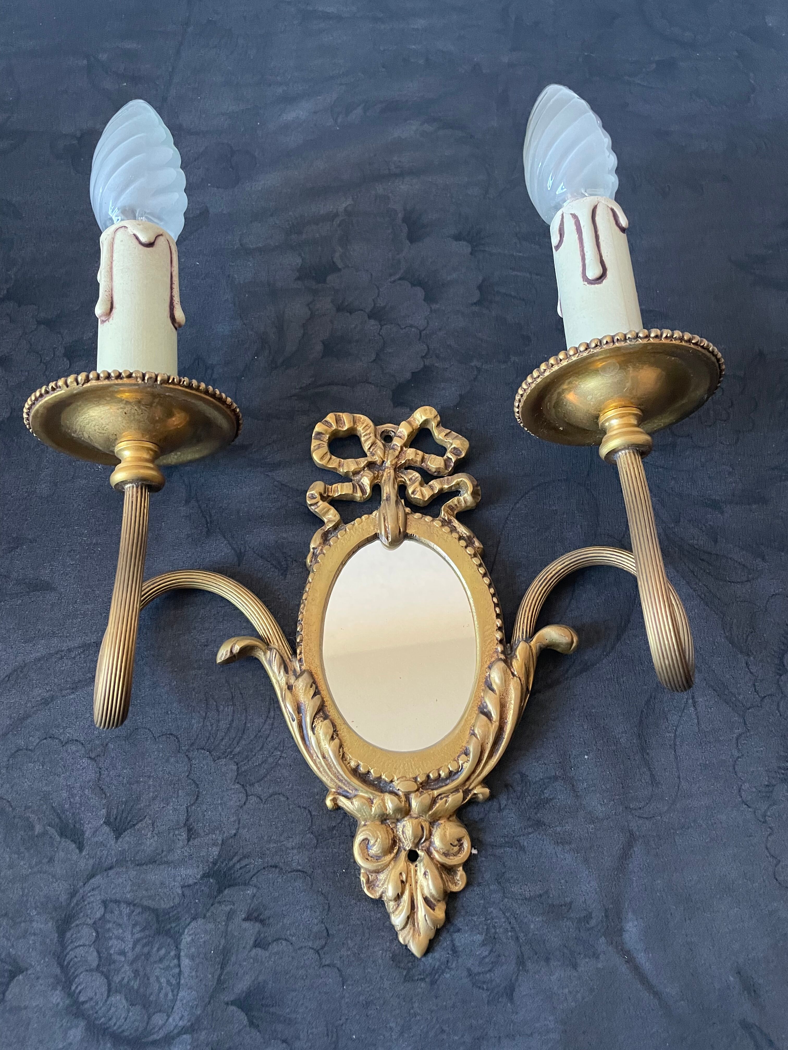 Pair of bronze wall lamps with mirror