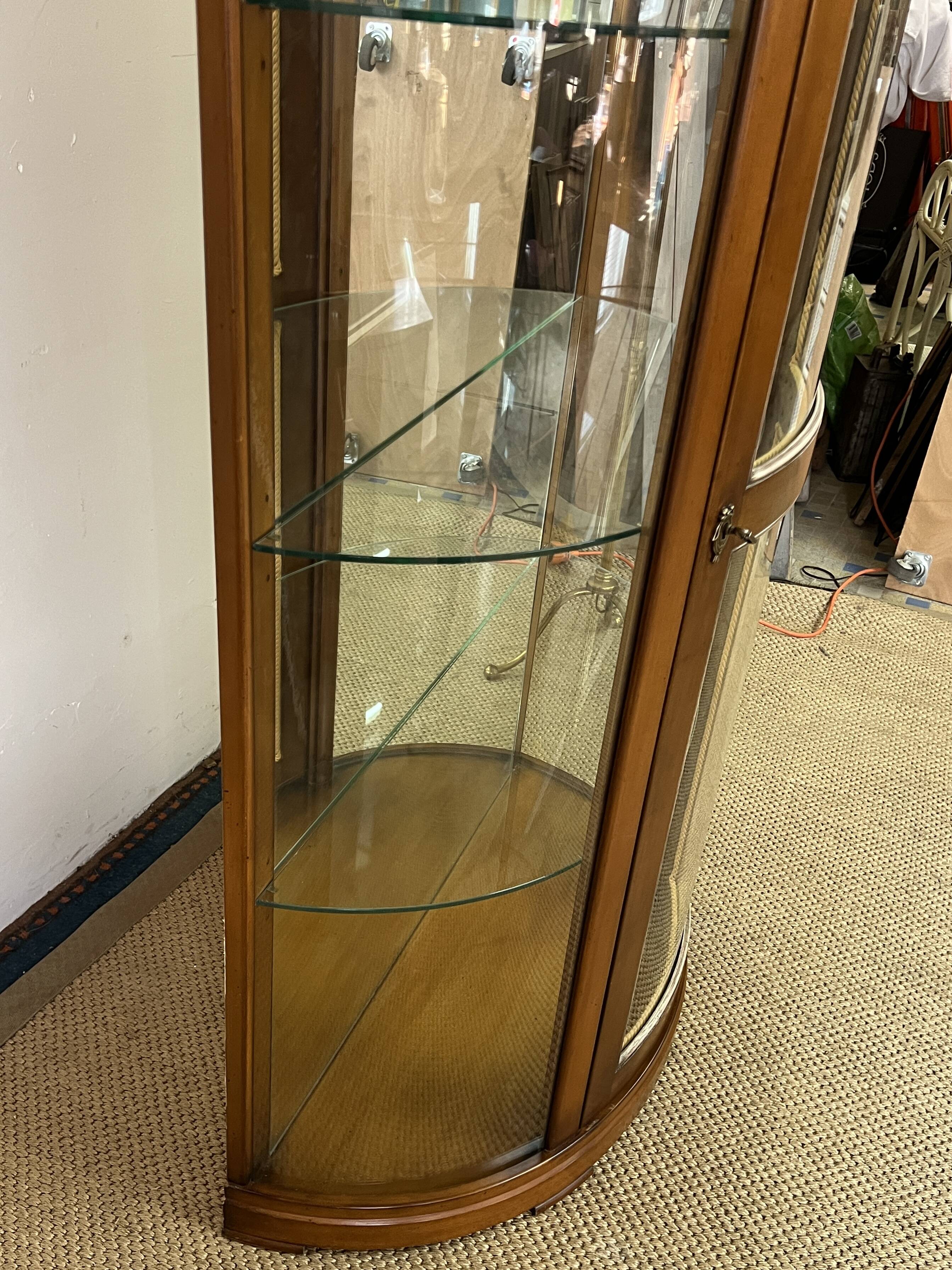 Wooden display case and half-moon mirror