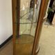 Wooden display case and half-moon mirror