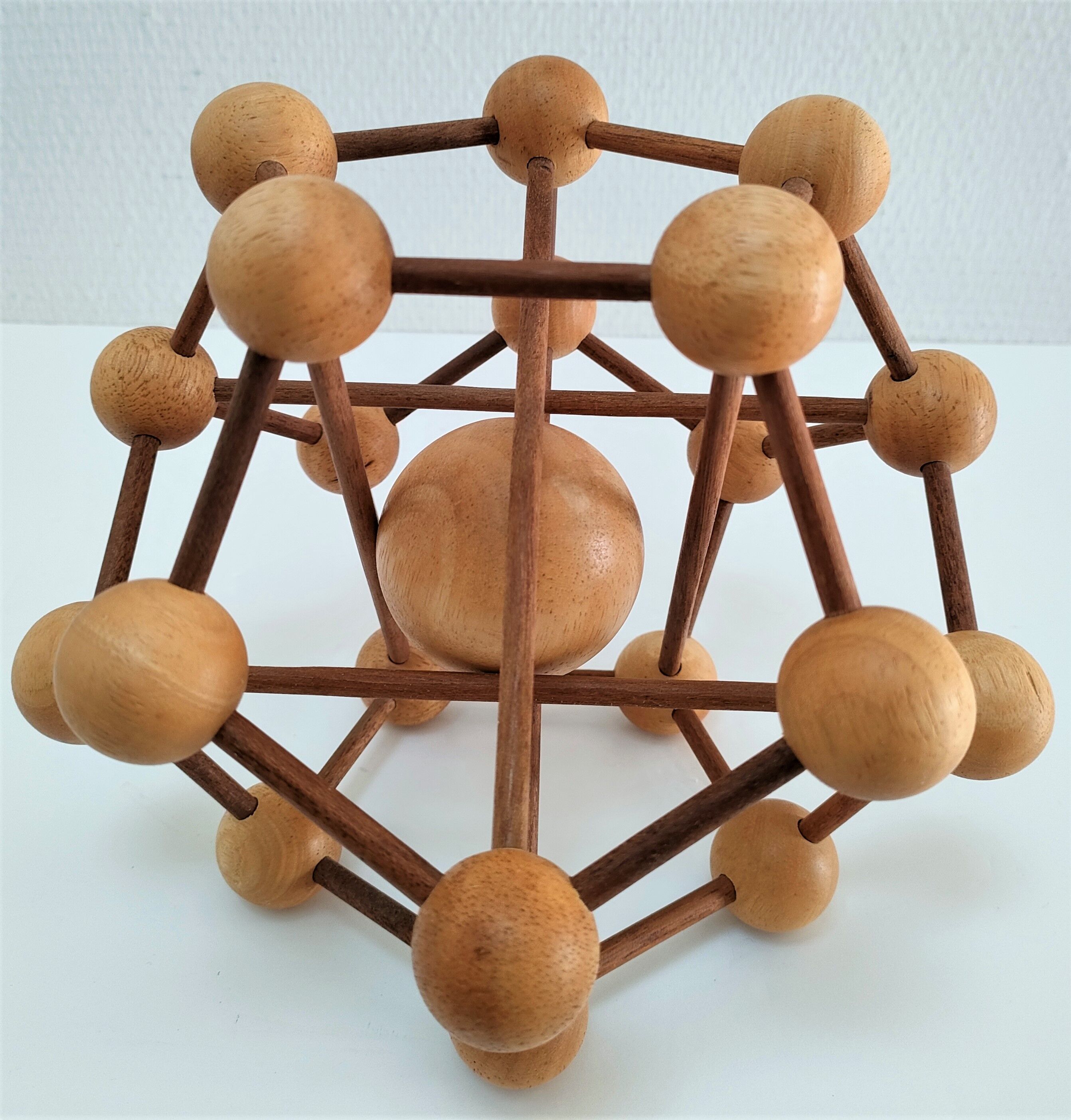 Sculptural modeling of a solid wood atom contemporary design