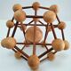 Sculptural modeling of a solid wood atom contemporary design