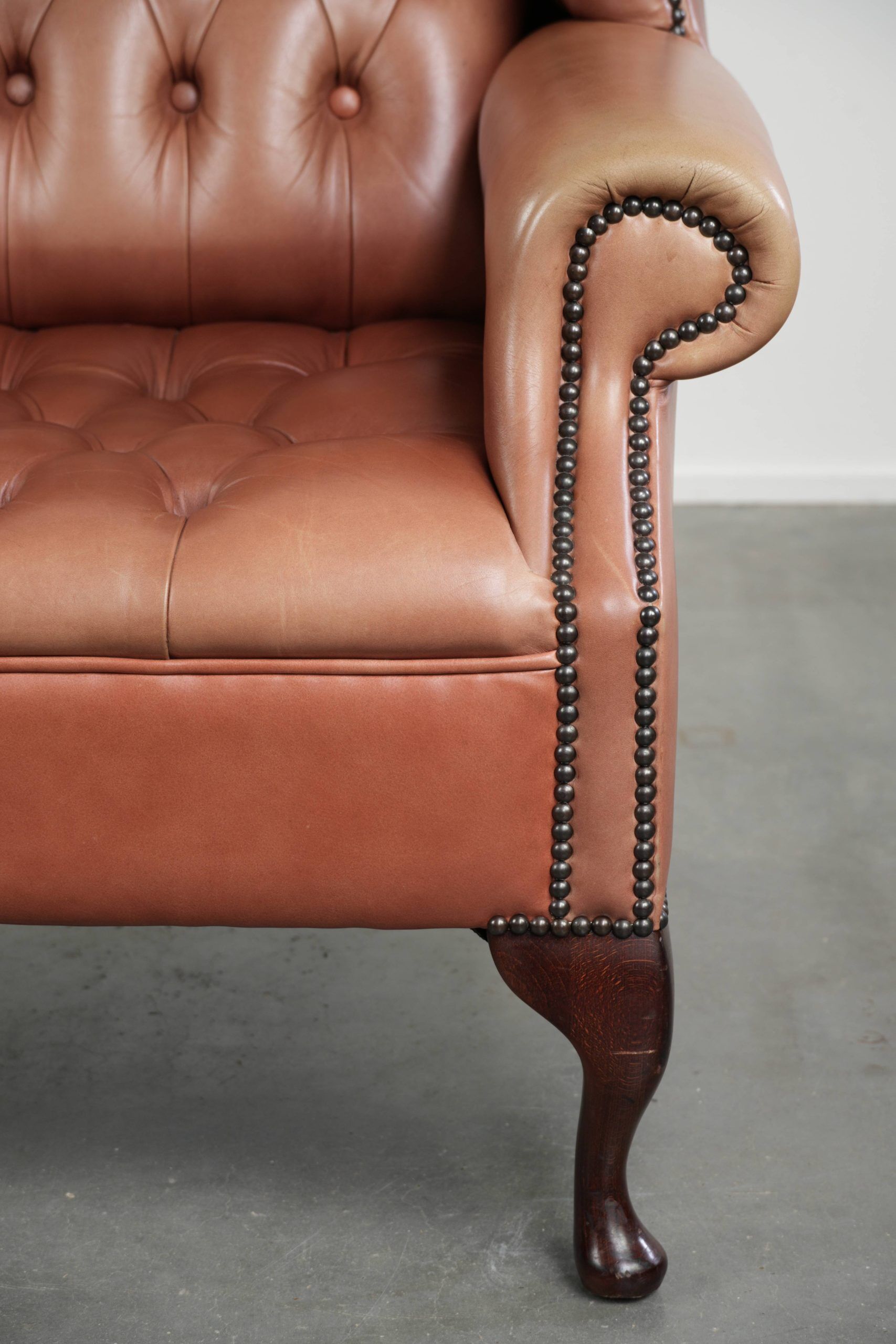 Classic English cowhide button seat chesterfield wingback armchair