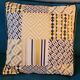 Coussins graphiques passepoil cuir