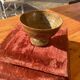 Speckled stoneware bowl on a stand