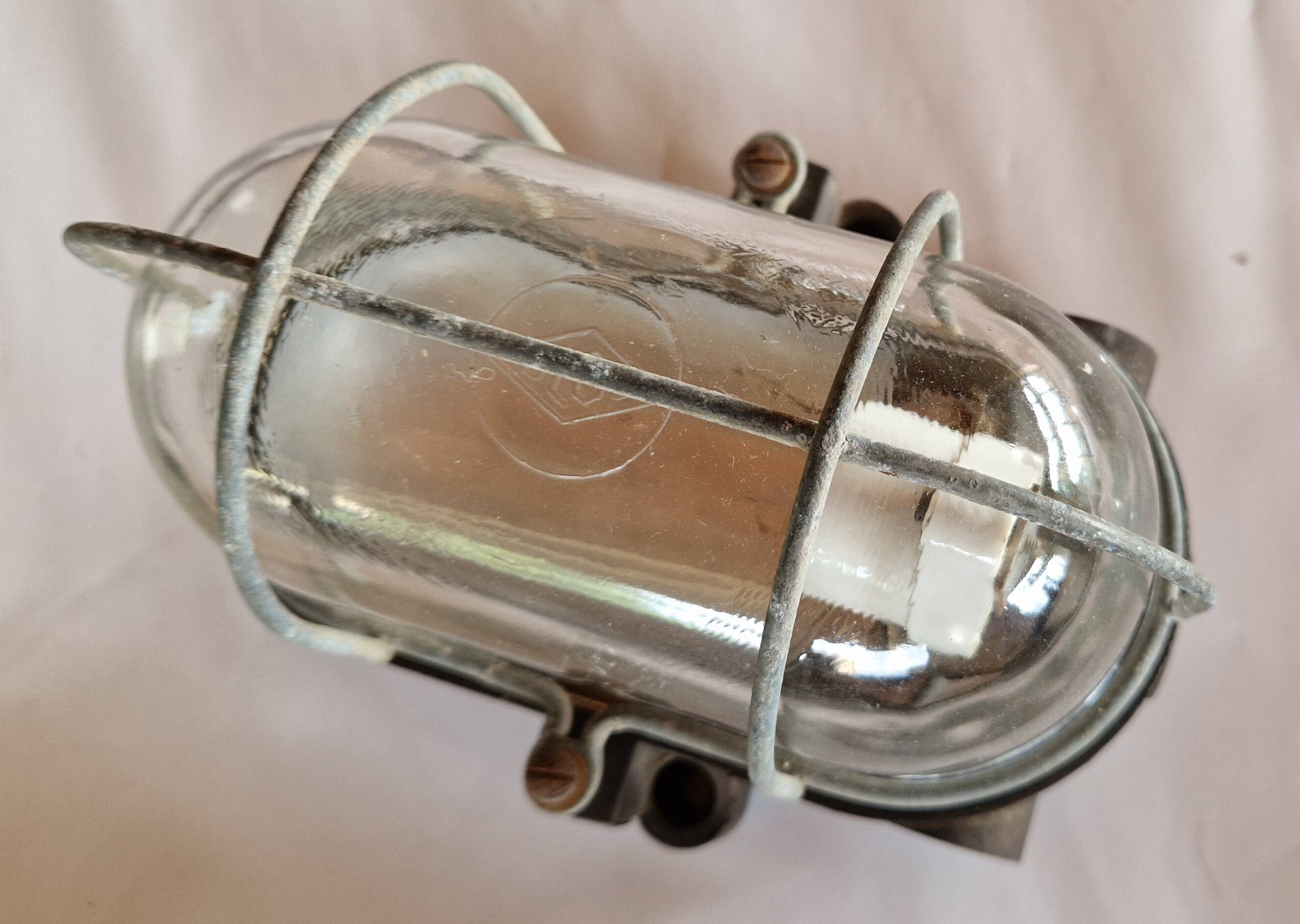 Pair of oval porthole wall lights in bakelite and glass