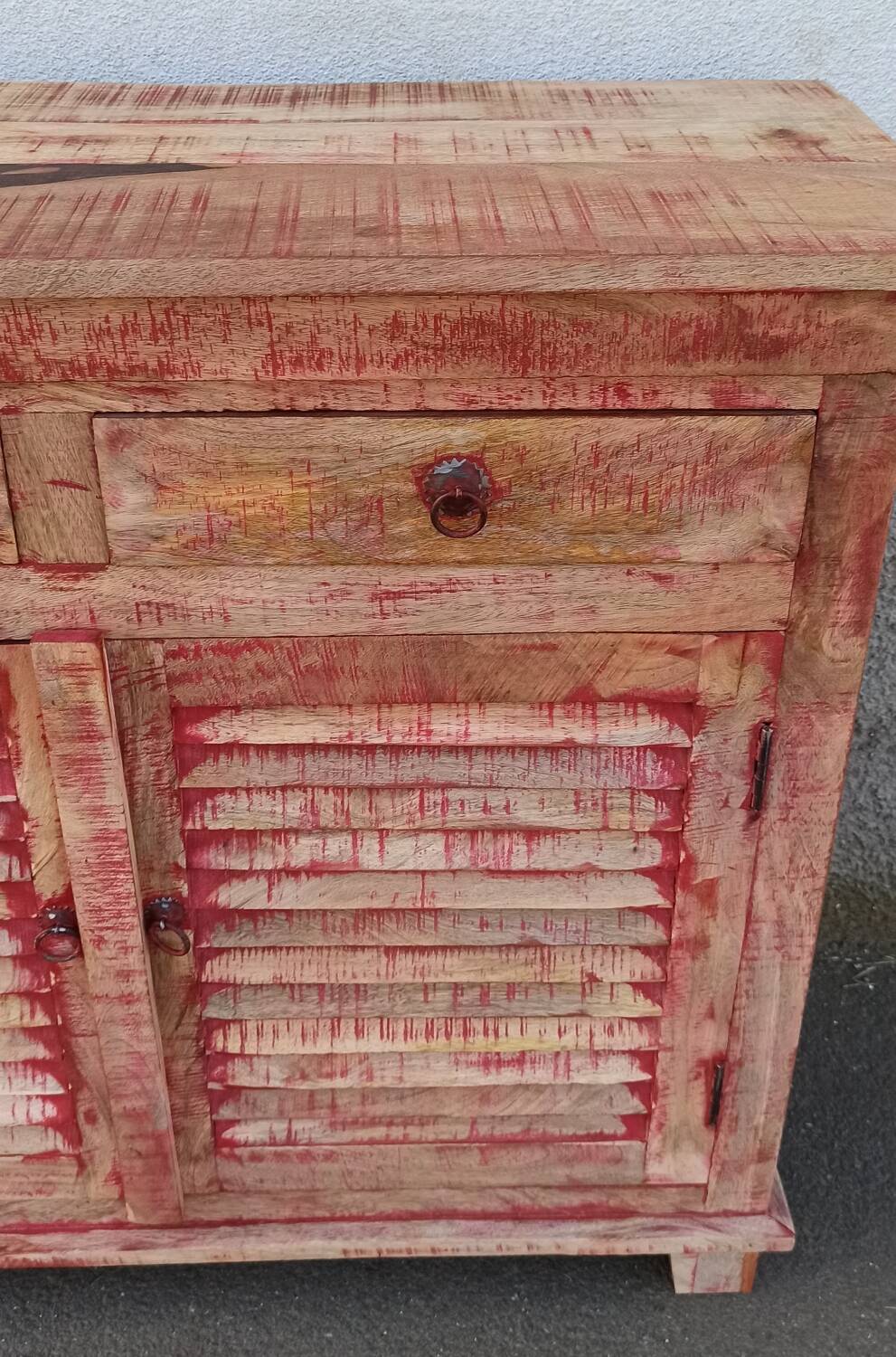 Wooden sideboard with red highlights
