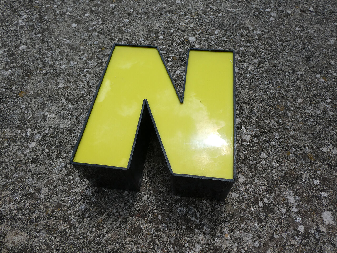 Yellow and black industrial sign letter "N"