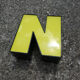 Yellow and black industrial sign letter "N"