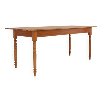 Rustic French farm table in wood with turned legs, ca. 1850