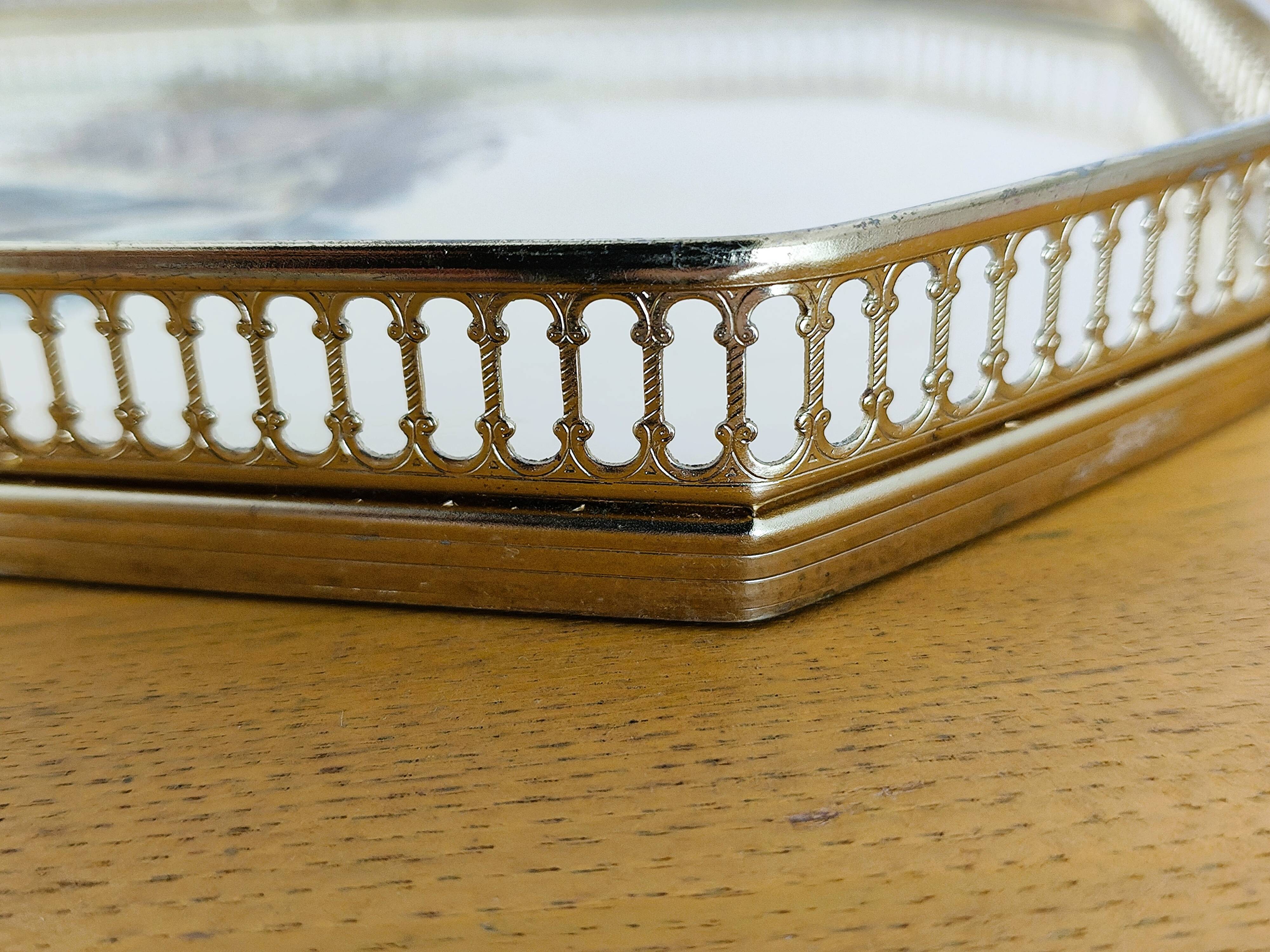 Vintage service tray with a golden gallery and mirror, decorated with ducks.