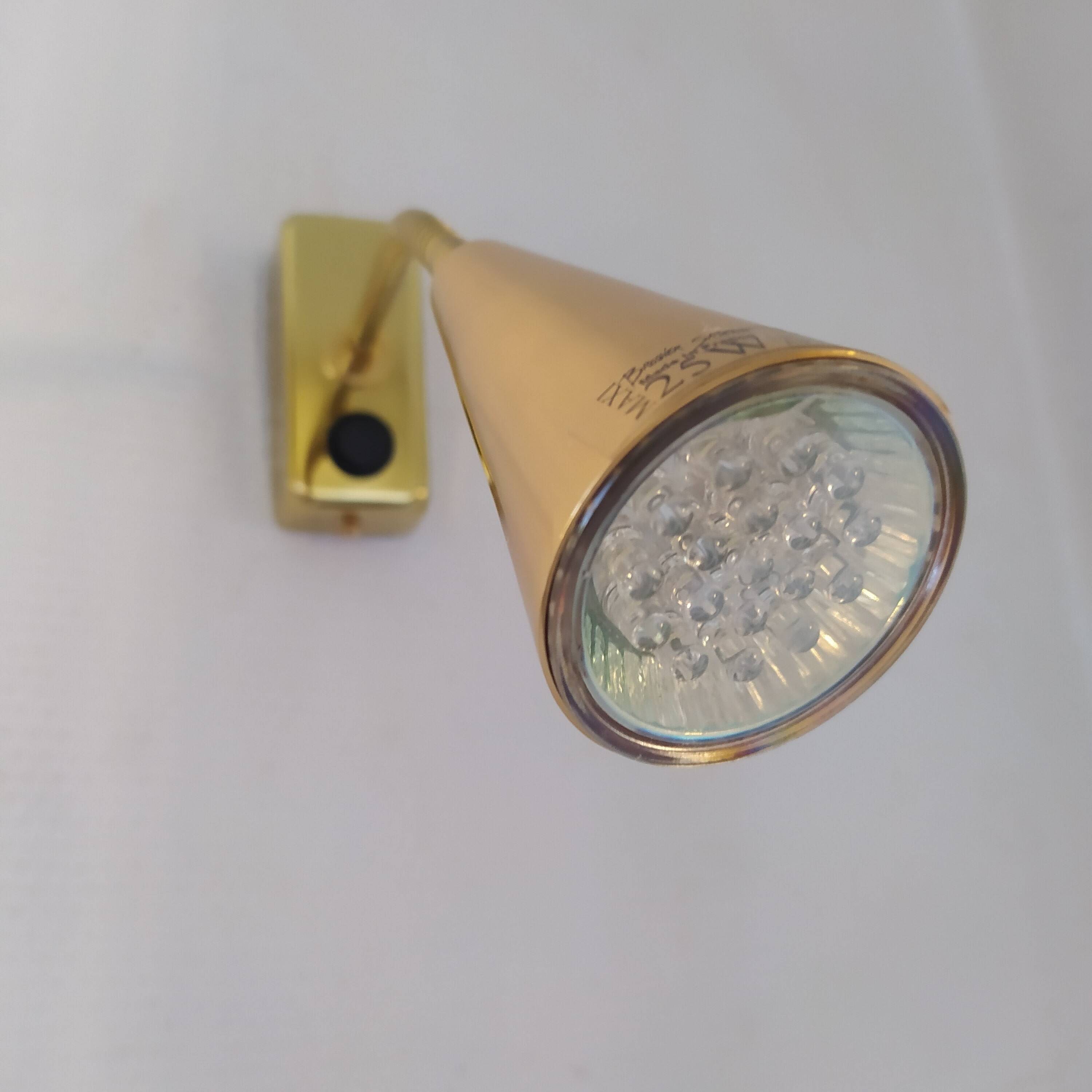 Pair of golden wall lights from the brossier saderne brand