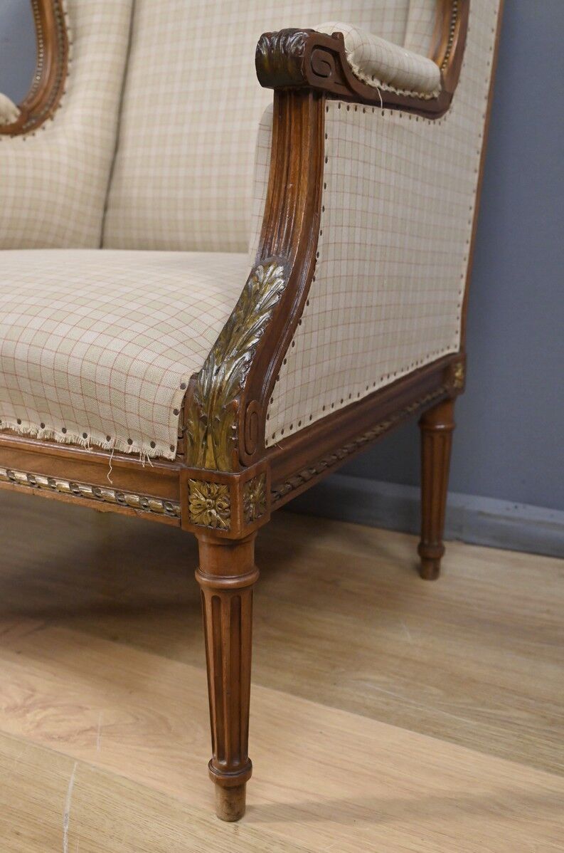 Wingback armchair in walnut, Louis XVI style – late 19th century