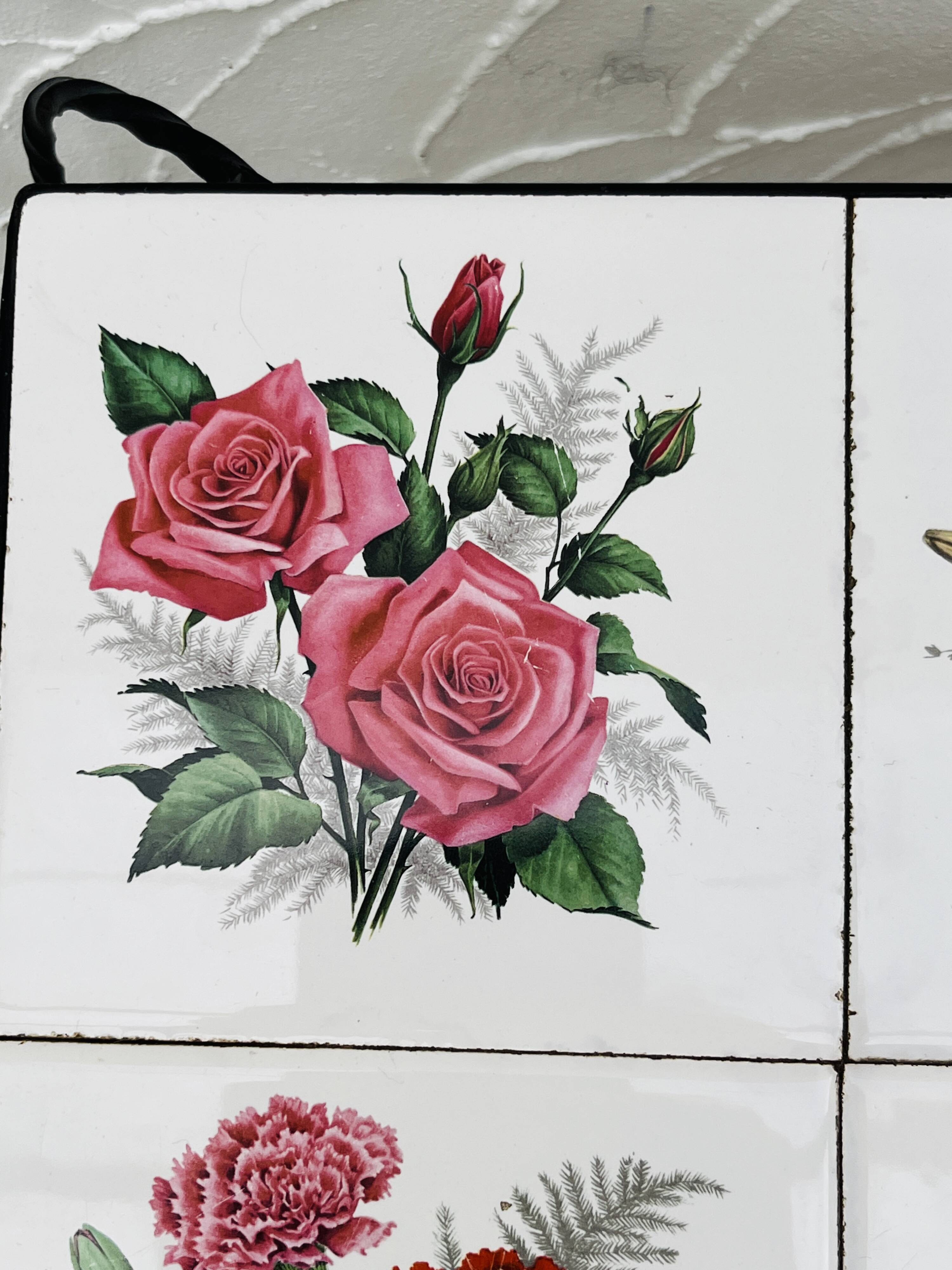 Vintage coffee table in wrought iron with floral tiles.