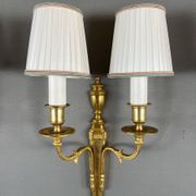 Set of three Louis XVI style wall sconces in gilded bronze, 20th century.