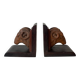 Pair of carved wooden bookends in the shape of ram's heads.