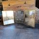 Antique French gilt metal triptych vanity mirror with floral crest