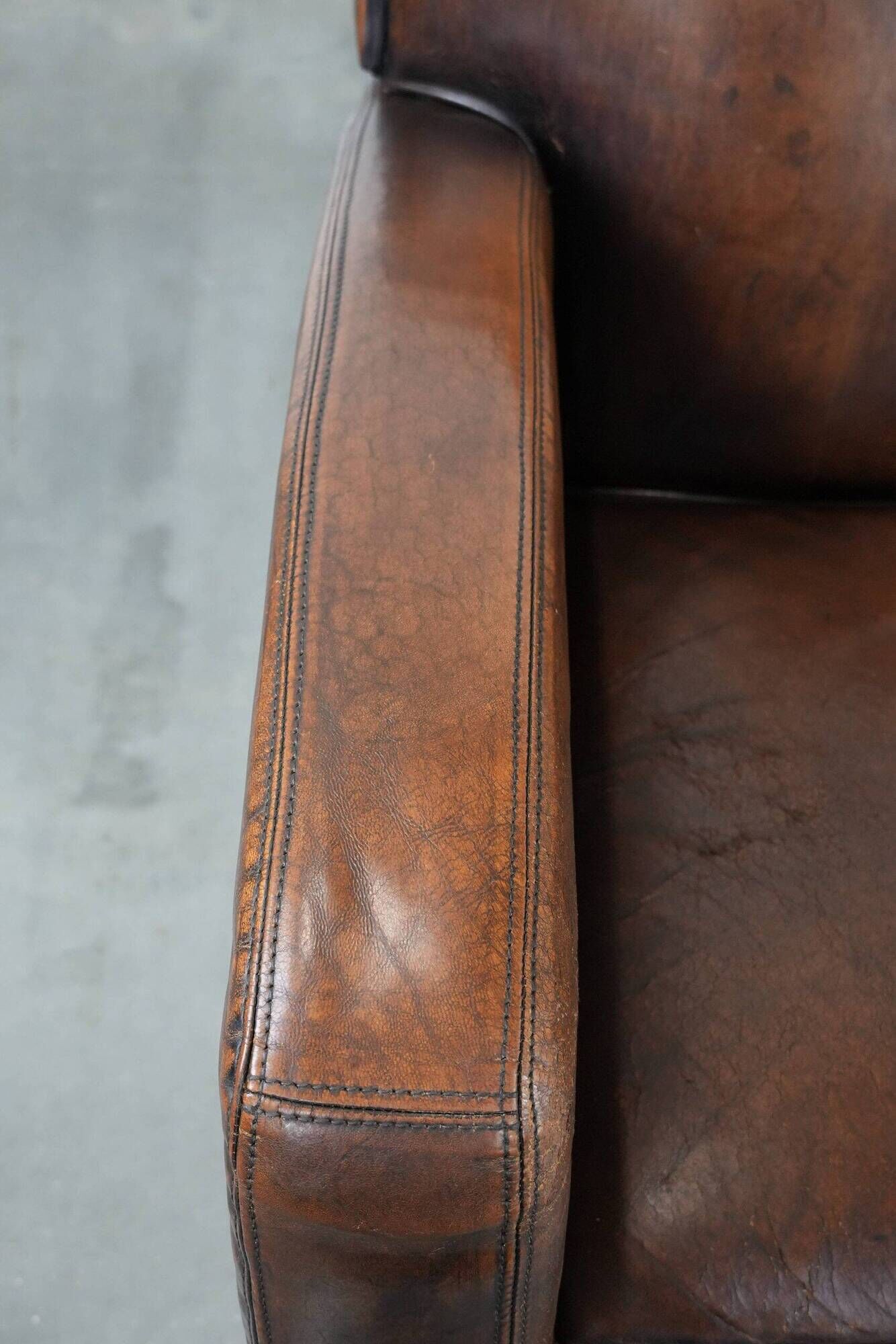 Characterful set of two vintage sheepskin armchairs with beautiful colours