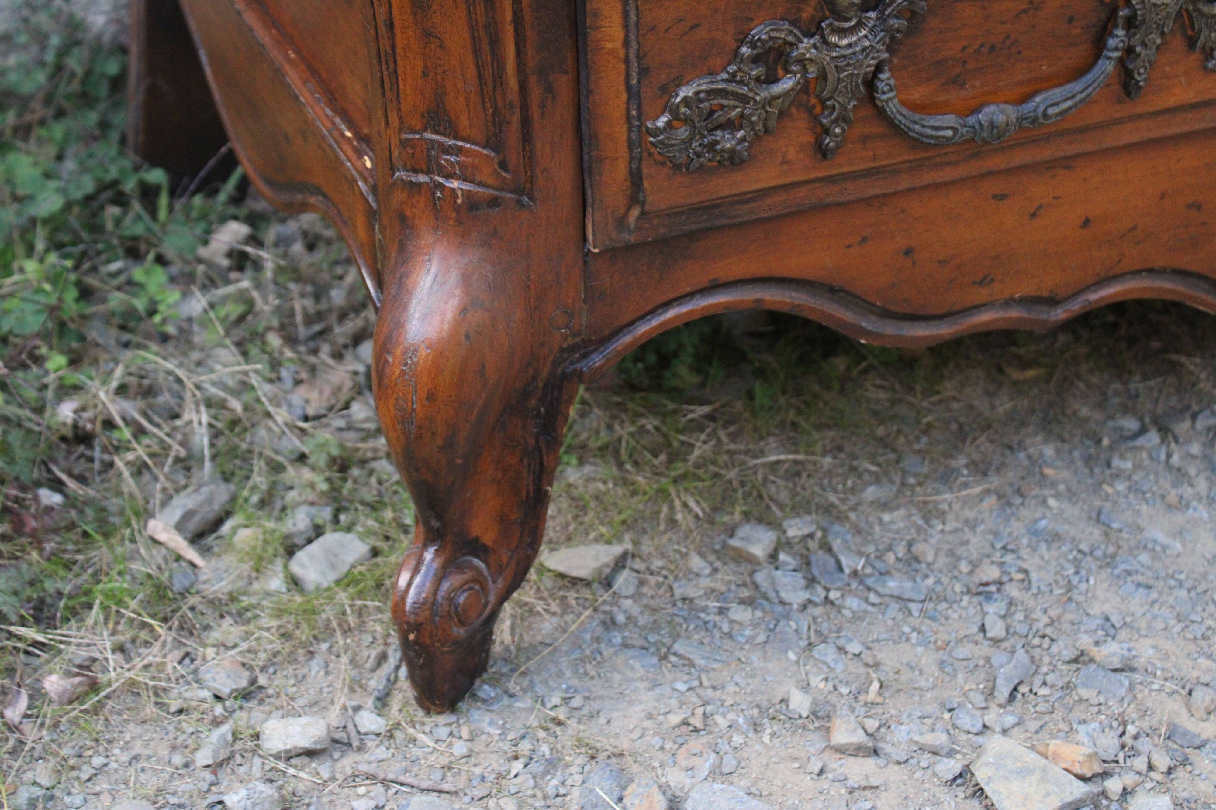 Curved Louis XV style chest of drawers known as a “tomb”