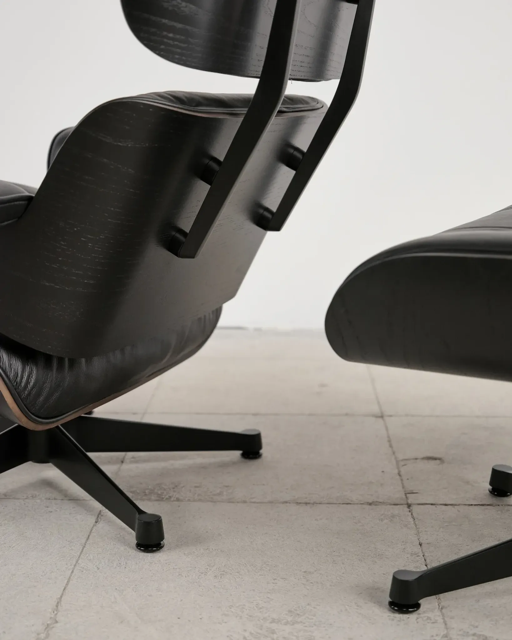 Lounge Chair and ottoman in black leather by Charles & Ray Eames, Vitra