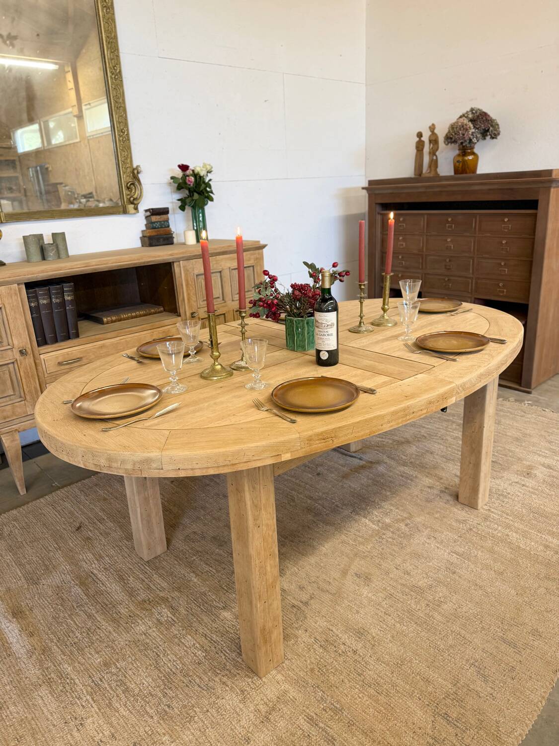 Oval farmhouse table in solid oak with extensions.