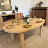 Oval farmhouse table in solid oak with extensions.