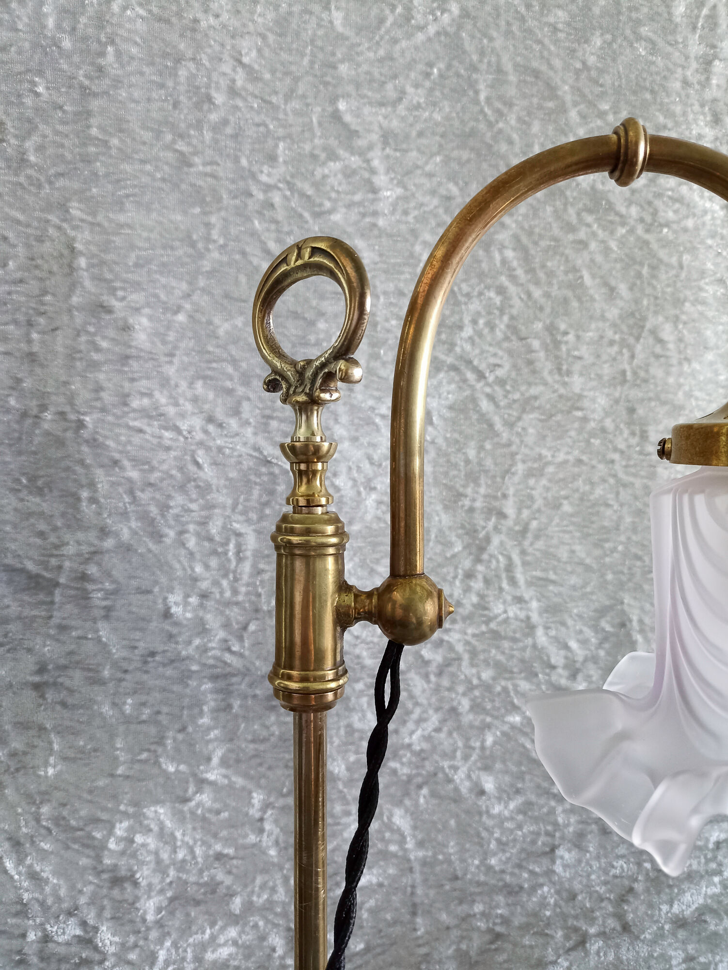 Adjustable brass desk lamp with frosted glass tulip