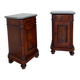 A pair of antique walnut bedside tables from the 1890s.